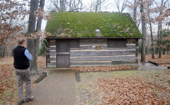 Missouri State Parks director Bill Bryan walks towards a restroom built seven decades ago by the Civilian Conservation Corps that's still in service at Lake of the Ozarks State Park in Kaiser, Mo.